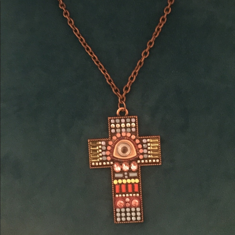 The Eye Of Horus,  third eye on cross pendant.